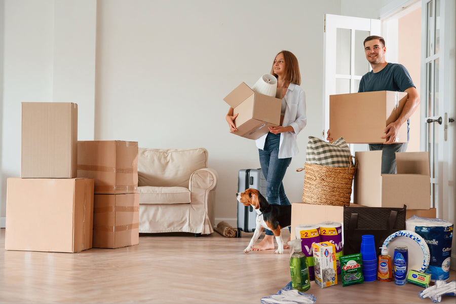 Family unpacking in new home with welcome home box move-in essentials ready on day one